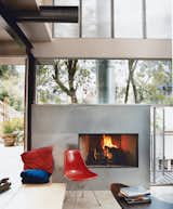 Architects Alice Fung and Michael Blatt designed their own home in Los Angeles, complete with a modern fireplace design clad in galvanized steel.