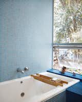 Bath Room, Mosaic Tile Wall, and Drop In Tub The tile is by Carter.  Search “Tile” from How This Couple Broke The Rules in a LA Suburb