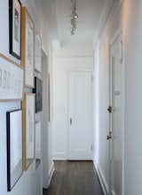 A narrow hallway, typical of prewar apartments, doubles as an art gallery lined with woodcut type studies by graphic artist Jack Stauffacher, type sketches by Erik Spiekermann, and photography by Catherine Opie and Catherine Ledner.