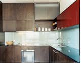 MS-31 designed and built all the kitchen cabinetry, as well as the dining table, in collaboration with Archkinetics. The frosted-glass backsplash offers easy cleaning.  Photo 5 of 11 in Making Sense of the City