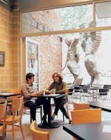 Architect Dutch MacDonald and developer Eve Picker relax at the Pittsburgh Presse Deli in the building’s ground-floor storefront. Designed by MacDonald’s Edge Studio, the restaurant serves gourmet panini six days a week.