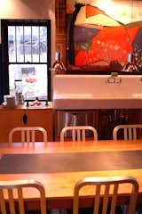 The double sink was originally in the basement of the house and used for gardening, but Moore moved to the kitchen. “We re-enameled it, which is a disgusting process that I wouldn’t recommend anyone to do,” Moore says.

Photo courtesy of Mike Moore/Tres Birds Workshop