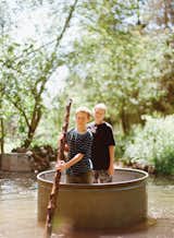 Outdoor Dylan, 10, and Zoe, 13, have a lazy float down the creek, Huck Finn–style, in a steel horse-watering tank.  Photo 3 of 13 in Diamond in the Rough (and Ready)