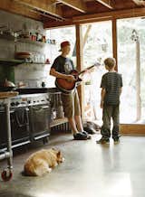 Cody, 17, and Dylan jam in the kitchen with Yogi, the Welsh corgi.