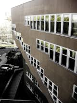 An exterior view of the cantilevered staircases that run up and down the north side of the building.