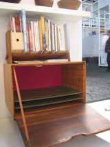 In the booth of LA showroom Reform we found this beautiful drop-door cabinet and book shelf, made by Bolinas, California's late, great woodworker Arthur Espenet Carpenter. Bleached walnut and wenge form the frame, and the rear of the interior has a secret bright spot, lined with a fuschia board.  -Sarah