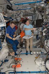 Canadian Space Agency astronaut Robert Thirsk and NASA astronaut Nicole Stott, both Expedition 21 flight engineers; along with European Space Agency astronaut Frank De Winne (background), commander, work in the Harmony node of the ISS. Photo taken October 15, 2009. 

Courtesy of NASA