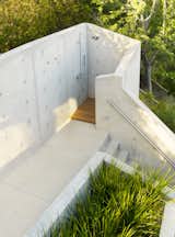 The outdoor shower below the treehouse was shaped and formed from concrete to be a truly private experience.