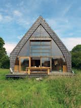 Exterior, Cabin, House, A-Frame, Shingles, and Wood In the tiny town of Auvilliers, France, architect Jean-Baptiste Barache designed an elegant cedar-shingled home with an A-frame construction.  Exterior A-Frame House Photos from Modern Wooden A-Frame Retreat in France