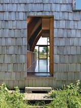 Doors and Exterior The front door dissolves into the facade.  Photo 11 of 11 in Modern Wooden A-Frame Retreat in France