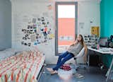 Thijske Noordhoek relaxes in her study-cum-bedroom.