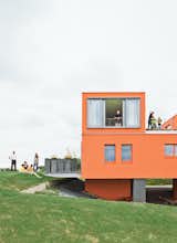 Exterior, House, Flat, and Apartment Cees, Jacquelien, Jillis, Lucas, and Thijske Noordhoek gather on the lawn; Andy Dochter looks out of the window while his wife Miriam stands on the terrace with sons Thomas and Vincent.  Exterior Apartment Flat Photos from Modern Communal Living in the Netherlands
