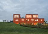 Villa Van Vijven cuts a truly remarkable figure, a striking orange figure on the otherwise flat green landscape.