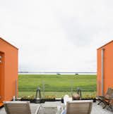 The nearby lake makes for a pretty setting, especially when framed by Villa Van Vijven's orange facade.