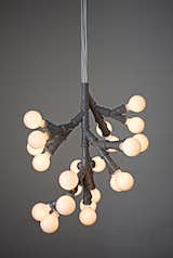 Bunch of Bulbs pendant lamp by KiBiSi. Designed in 2005 with standard plumbing fittings. Limited Edition. 

Photo courtesy of KiBiSi