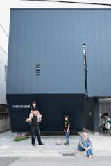 The black facade of the Yatabes’ house may turn a darkly futuristic face to its suburban block, but behind it the house is full of light. In Saitama, a tightly packed neighborhood near Tokyo, the black metal screen affords the family privacy without sacrificing outdoor space.
