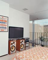 An Alexander Girard poster for the Herman Miller Textile &amp; Objects Shop in the master bedroom is original to the house.