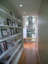 A long bookcase connects the master bathroom to the bedroom.  Search “livingfurniture--bookcase” from Bedroom Addition in Seattle