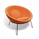 Bo Bardi’s Bowl chair, designed in 1951 of iron and aluminum, with orange fabric.
