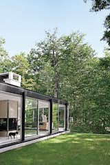 Exterior, Brick Siding Material, Mid-Century Building Type, House Building Type, and Flat RoofLine All of the glazing along the house’s 95-foot-long western elevation can be opened to the out of doors.  Search “glazing” from Mod Men