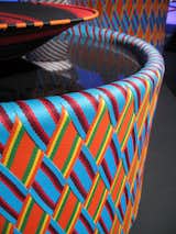 A detail shot of the interwoven textile covering the Kente table, by Philippe Bestenheider for Varaschin.