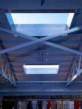 Skylights afford much of the lighting, though the exposed trusses and cool hues give the shop a delightfully industrial feel. Photograph by John Linden.