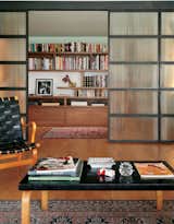 Jaklitsch's Svensson Loft in New York is a mid-century design fan's fantasy of ample light and lovely wood. A generous library (behind the paneled doors) can be closed off completely from the rest of the house. Photograph by Paul Warchol.  Photo 3 of 6 in Mid-Century  by Jill Southern from Stephan Jaklitsch