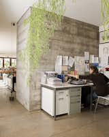 The open office space is partially secluded thanks to the hanging Algues by Ronan & Erwan Bouroullec for Vitra.
