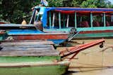 Several of the colorful wooden tourist boats lined up, also known as ‘river taxis.’