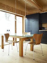Dining Room, Chair, Table, Pendant Lighting, and Light Hardwood Floor Black and blond are a natural match in Bornstein's largely wooden kitchen.  Search “natural habitats” from Knotty by Nature