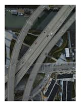 This photo is called 3rd and 6th and graphically describes a variety of forms of transits, the freeway superimposed over the waterway.