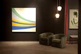 Eodroon, 2005, an acrylic-on-canvas hard-edge painting by Grant Wiggins, at left, and an untitled oil-on-canvas painting by Jason Fitzmaurice, with a pair of 1950s green mohair tub chairs by Edward Wormley for Dunbar. Photo courtesy Elko Weaver.