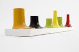 Bosa, Venini, Laboratorio 2729 all collaborated to create the ceramic candle holders of Luca Nichetto's Essence Cinque series. The modular items in the slick, colorful collection is meant to evoke the shape of pieces created by being poured into a mould.