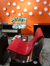 A steel-and-leather chair by French designer Maria Pergay (born in 1930), one of only eight, before a 1970 steel chair covered in vintage Pucci fabric. From Dragonette.  Photo 3 of 12 in The 2010 LA Modernism Show by Erika Heet