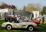A look at Bellini's dome with a collection of rare BMW 507s and visitors at Concorso d'Eleganza. According to Bellin's design notes, the walls are built with cement blocks with rose-ochre paste coloring, echoing that of the front of the existing Villa Erba. The dome roof support towers are faced in travertine and the flooring consists of gray lava and travertine slabs.  Search “依波表5032和5072<精仿+微wxmpscp>” from Concorso d'Eleganza 2010
