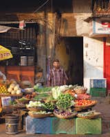 A streetside vegetable purveyor shows his offerings.