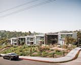 Seven town homes, with slivers of air between them, possess the appearance and energy-saving advantages of row houses.