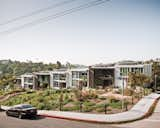 Seven town homes, with slivers of air between them, possess the appearance and energy-saving advantages of row houses.  Photo 1 of 1 in Podcast: Green Design with the Climate Desk from Lucky 7