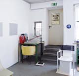 A poster on one of the doors of his studio  reads “No to war!”.