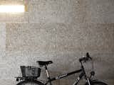The lobby-cum-garage plays home to the couple’s favorite forms of transport: 

a bike and Spiekermann’s Audi.  Photo 9 of 16 in A Rational Approach