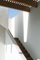 Sunlight and shadows accentuate the architectural forms around the stairway leading to the roof deck.