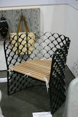 From Singapore comes the lovely Koi Metal Fence Chair by Jarrod Lim. I love the geometric repetition of the design, whose stark metal lines are cut with just a touch of whimsy: small cloth ties.