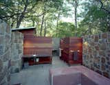 With its Brazilian Tigerwood enclosures, the outdoor bathhouse, which includes showers, sinks and dressing areas, references the nearby bunkhouse.