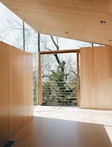 The bright, reflective surface amplifies natural light and bathes the interior in a warm glow even when the New England sun isn’t cooperating.  Photo 1 of 67 in Best Photos by Thomas Bouquin from A Striking Angular Cottage in Connecticut