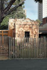 From the street, the most visible element of the George Street Residence is the original brick structure.  Photo 4 of 9 in An 1860s Stable Modernized in Melbourne
