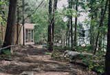 Outdoor and Trees Suzanne Shelton built a "little cottage to get away to" on Tennessee's Norris Lake that's equipped with both rainwater-harvesting and solar-power systems for off-the-grid living.  Search “little-feet-off-the-grid.html” from How to Build an Off-the-Grid Cabin
