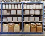 Stacks of unglazed dishware line the shelves at the Heath factory in Sausalito.