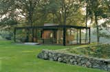 The house that started it all: Philip Johnson's Glass House in New Canaan. He and David Whitney used to invite great minds from the architecture, design, and art worlds to the house for evenings of discussion and debate. When the Glass House opened to the public in 2007, its programmers continued the invitation-only tradition.  Photo 47 of 51 in 50 Jaw-Dropping Glass Houses That Shatter Expectations from Glass House Conversations