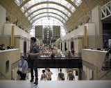 Perhaps the most striking aspect of the Musee d'Orsay is the spaciousness of its magnificent vaulted interior. The long central nave is punctuated by a series of bronze and stone sculptures, specifically six bronze 'allegorical sculptural groups' of the late 19th century.