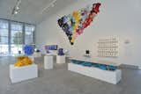 In the installation at the Yerba Buena Center for the Arts are two of Greg Lynn's Toy Furniture (front) as well as a collage of Threadless t-shirts, a company included for its crowdsourced and selected designs. Photo by Phocasso/J.W. White.